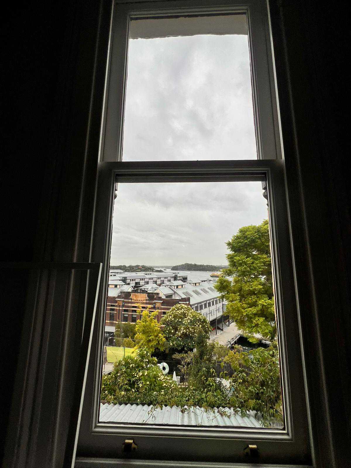 Streak-free heritage sash window with harbour view